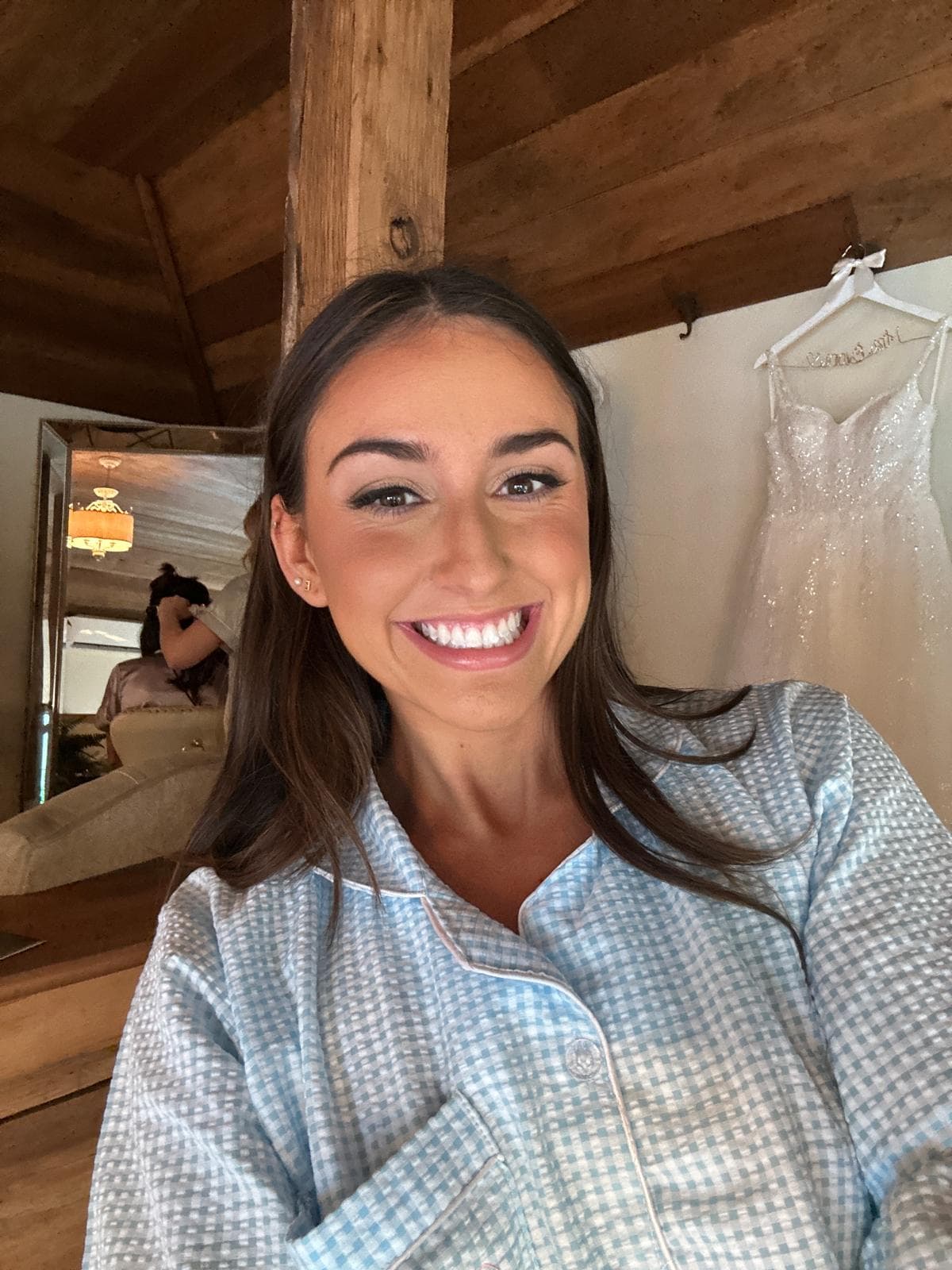 Happy first-time spray tan client with natural glow